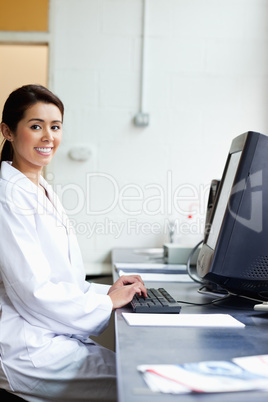 Portrait of a science student with a monitor