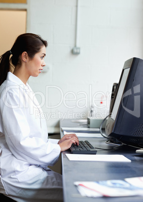 Portrait of a science student using a monitor