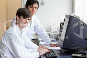 Scientists posing with a monitor