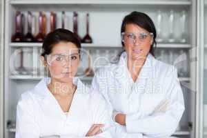 Serious female scientists posing