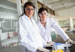 Science students wearing protective glasses