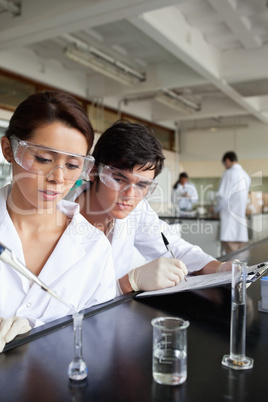 Portrait of young science students working