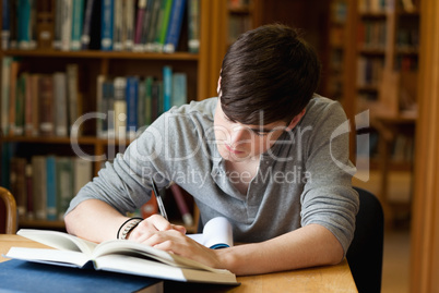 Focused male student working