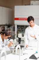 Portrait of young science students making experiments
