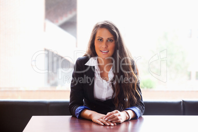 Young woman sitting at a table