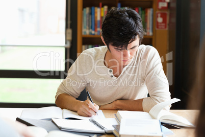 Male student working on an essay