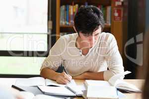 Male student working on an essay