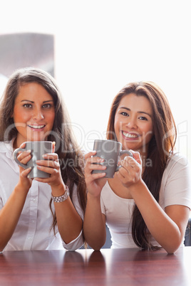 Portrait of friends having a cup of coffee
