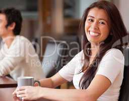 Happy woman having a coffee