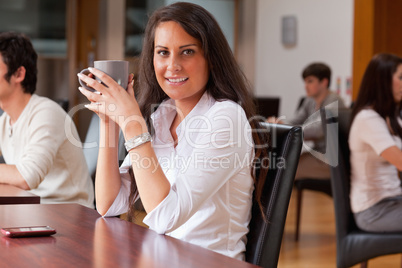 Young woman having a coffee