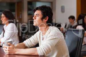 Handsome man having a coffee