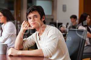 Young man sitting with a cup of tea