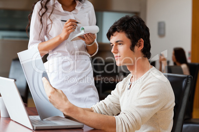 Man ordering food to a waitress