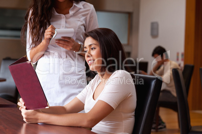 Young woman ordering food