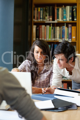 Portrait of smiling students working together