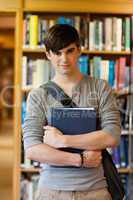 Portrait of young student holding a book
