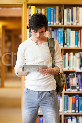 Portrait of a focused student using a tablet computer