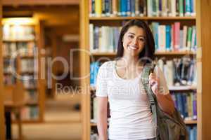 Smiling young student standing up