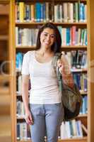 Portrait of a smiling young student standing up