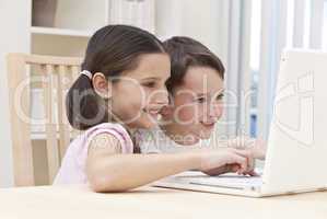 Boy & Girl Children Using Laptop Computer at Home
