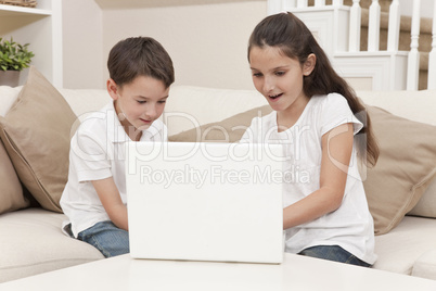 Boy & Girl Children Using Laptop Computer at Home