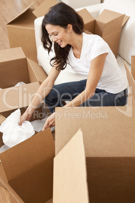 Single Woman Unpacking Boxes Moving House