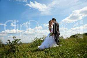 Wedding couple in sunny summer day
