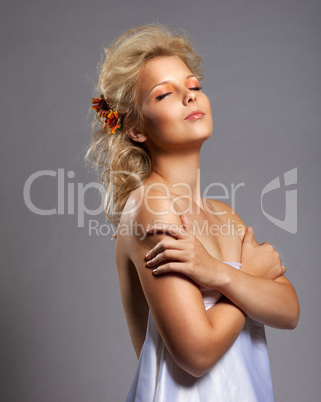 Beauty woman with flower close eyes in dream