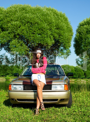 Beautiful girl ready for washing a retro car