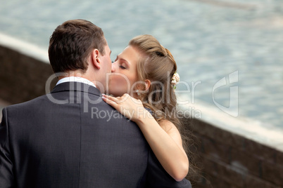 young wedding couple kissing