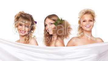 Three young woman with flower hair style