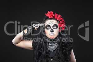Serious woman in skull mask shot in head