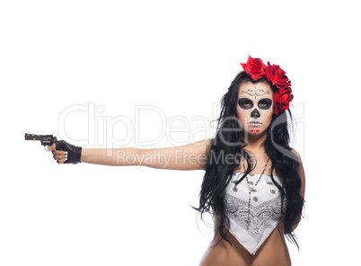 Serious woman in day of the dead mask with gun