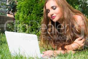 Beautiful girl with a laptop outdoor