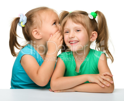 Two little girls are chatting
