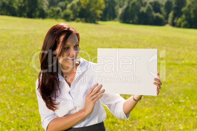 Businesswoman sunny meadow look at empty banner