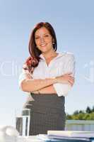 Businesswoman outside nature blue sky office smile