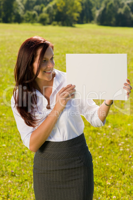 Businesswoman sunny meadow look at empty banner