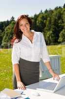 Businesswoman outside nature blue sky office smile