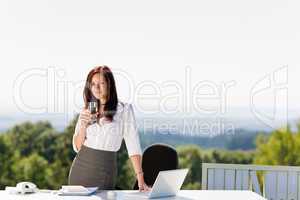 Young businesswoman in sunny nature office table