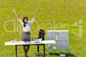 Businesswoman sunny meadow nature office hands-up