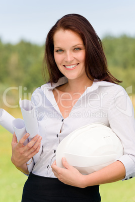 Architect woman in sunny nature smiling with laptop