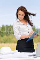 Businesswoman architect sunny nature write folder