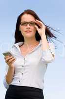 Businesswoman blue sky attractive look with phone