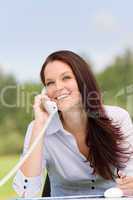 Businesswoman in nature attractive smile calling