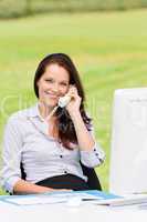 Businesswoman in nature attractive smile calling