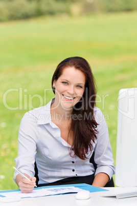 Businesswoman in nature attractive smile computer