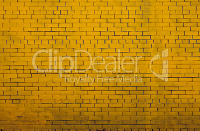 old yellow painted brick wall