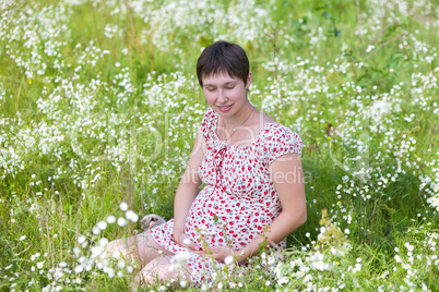 Pregnant woman with closed eyes