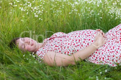 Pregnant woman with closed eyes